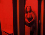 A Dutch prostitute in the red light district of Amsterdam